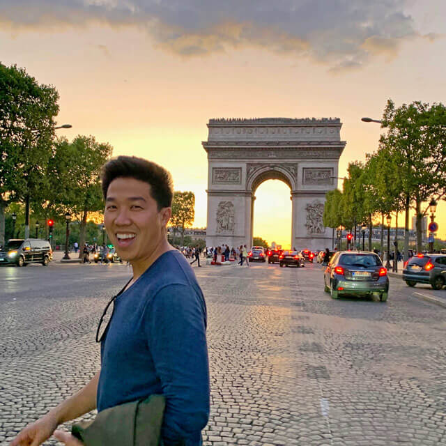 Aric in front of the Arc de Triomphe