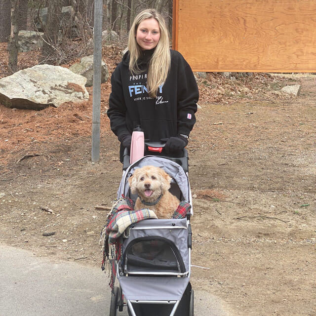 Katie with her dog in a stroller